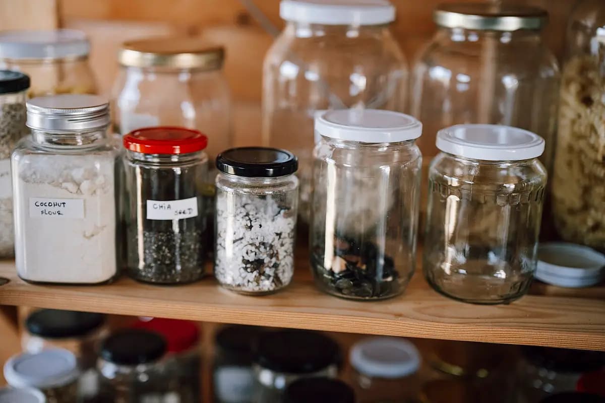 Glass jars of dry goods on a pantry shelf. Photo: Shixart1985 / Wikimedia Commons, CC BY 2.0