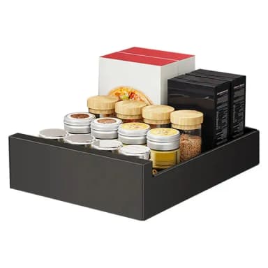 Black steel slide-out drawer holding spice jars and boxes, on a white background