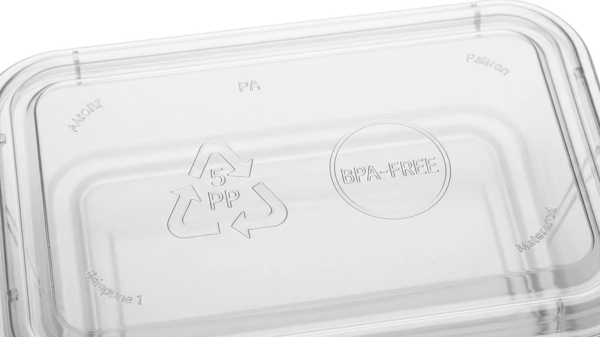 BPA-free certification labels and recycling codes on plastic food storage containers