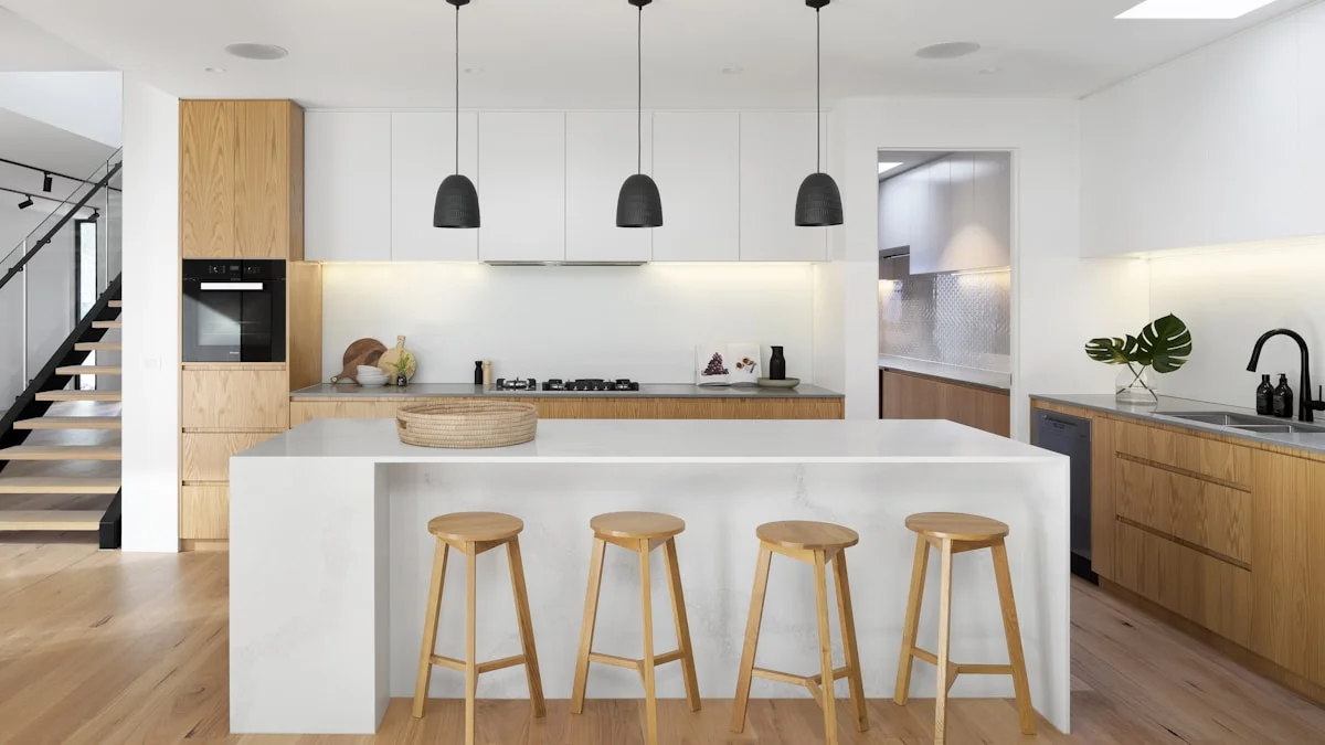 Minimalist kitchen with under-cabinet lighting and simple pendant lights