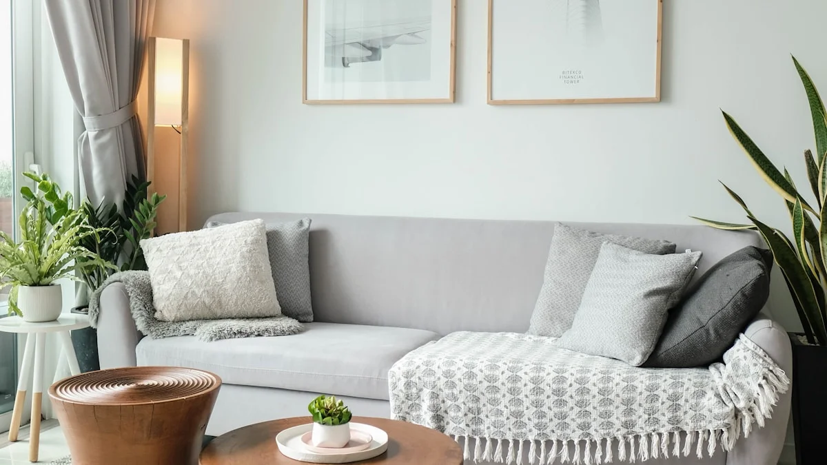 Small living room neatly arranged with minimalist furniture and natural lighting