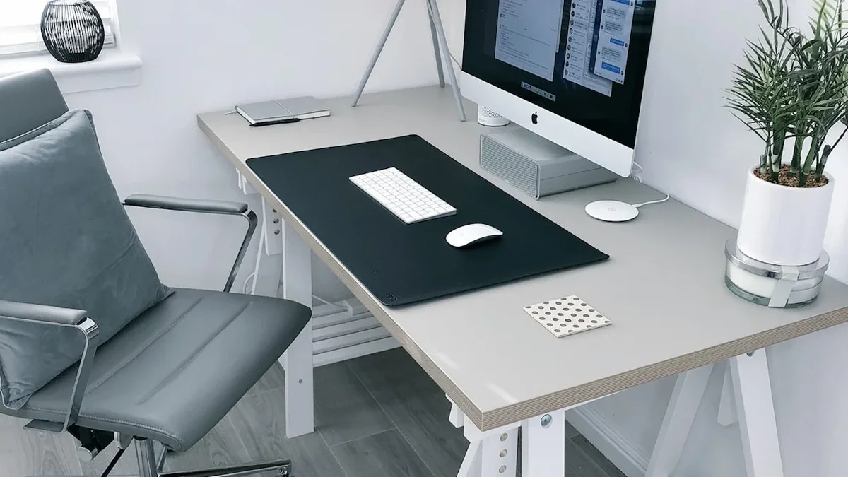 Ergonomic monitor stand on a neatly organized work desk